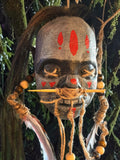 Latex Shrunken Head with Red Feathers