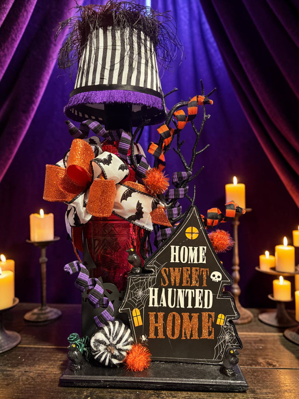 Halloween-Emporium Couture Haunted House Lamp with a black and white striped shade, orange bows, and gothic decor.