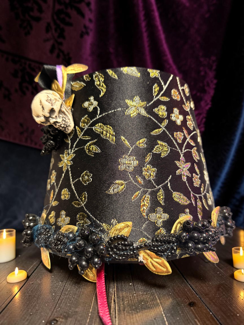 Halloween-Emporium gothic calla lily lamp featuring a black and gold floral fabric shade with skull and bead accents.