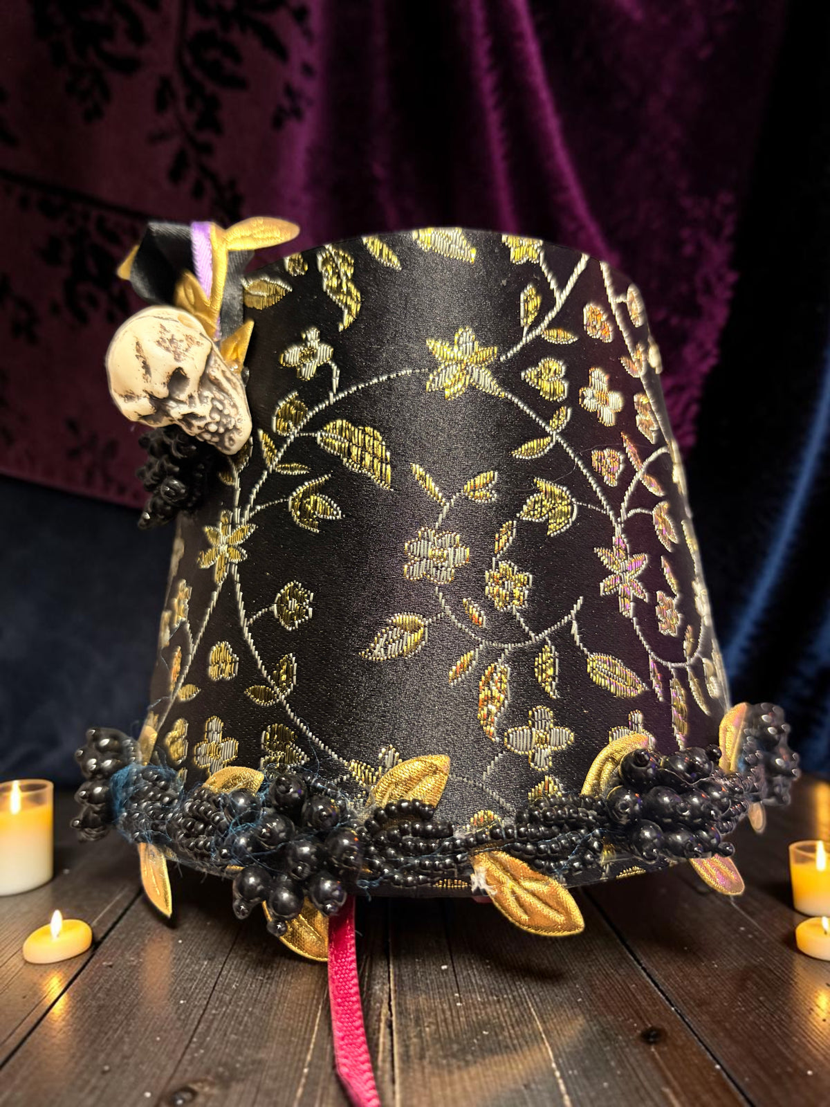 Halloween-Emporium gothic calla lily lamp featuring a black and gold floral fabric shade with skull and bead accents.