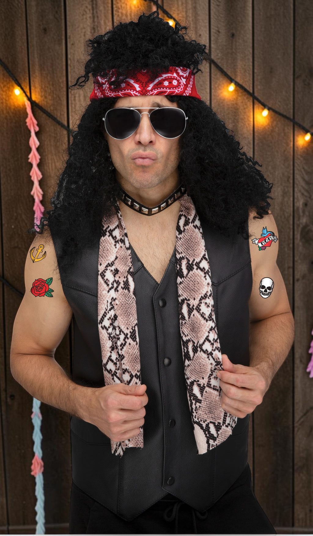 Halloween-Emporium 80s rocker costume kit featuring a red bandana, black wig, aviator sunglasses, and snake print scarf.