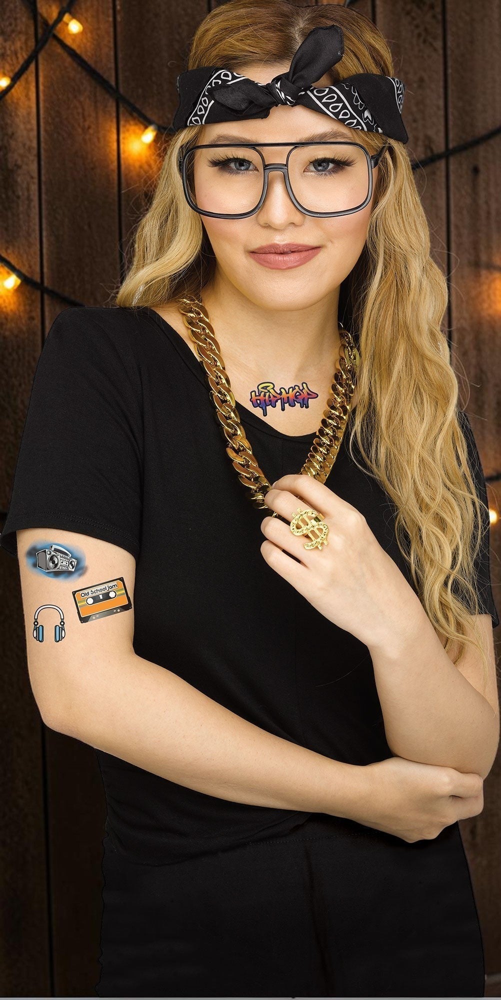 Halloween-Emporium 90s rapper costume kit with headscarf, oversized glasses, gold chain, ring, and temporary tattoos.