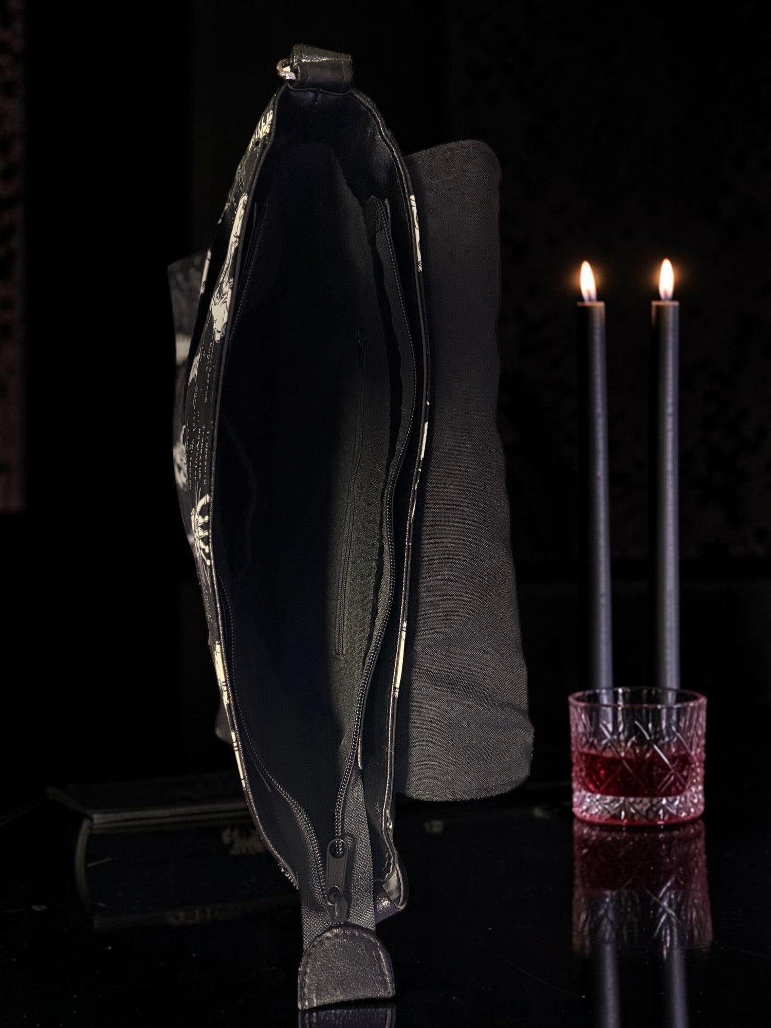 Halloween-Emporium anatomy messenger bag with skeletal print, featuring an open zippered main compartment.