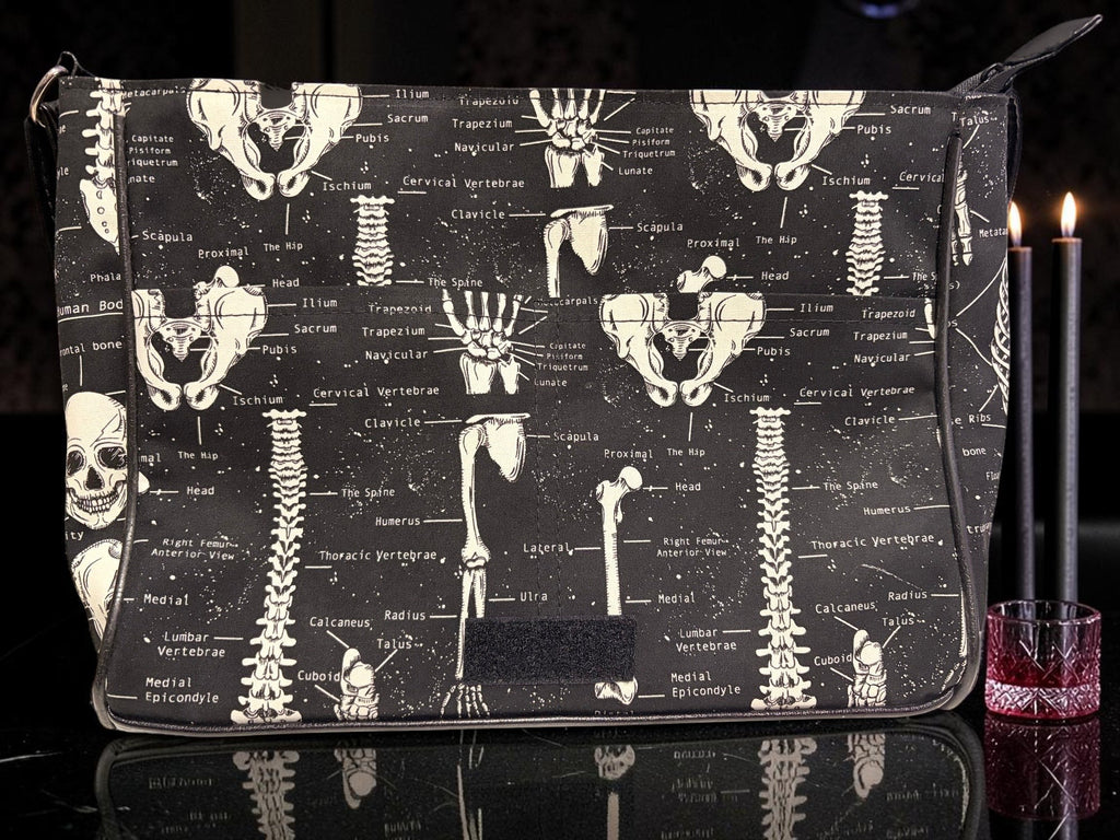 Halloween-Emporium anatomy messenger bag featuring a white skeletal system print on a black background