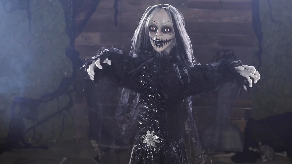 Halloween-Emporium 5.5 ft animated haunted bride prop in a black sequined gown with skeletal features and glowing eyes.