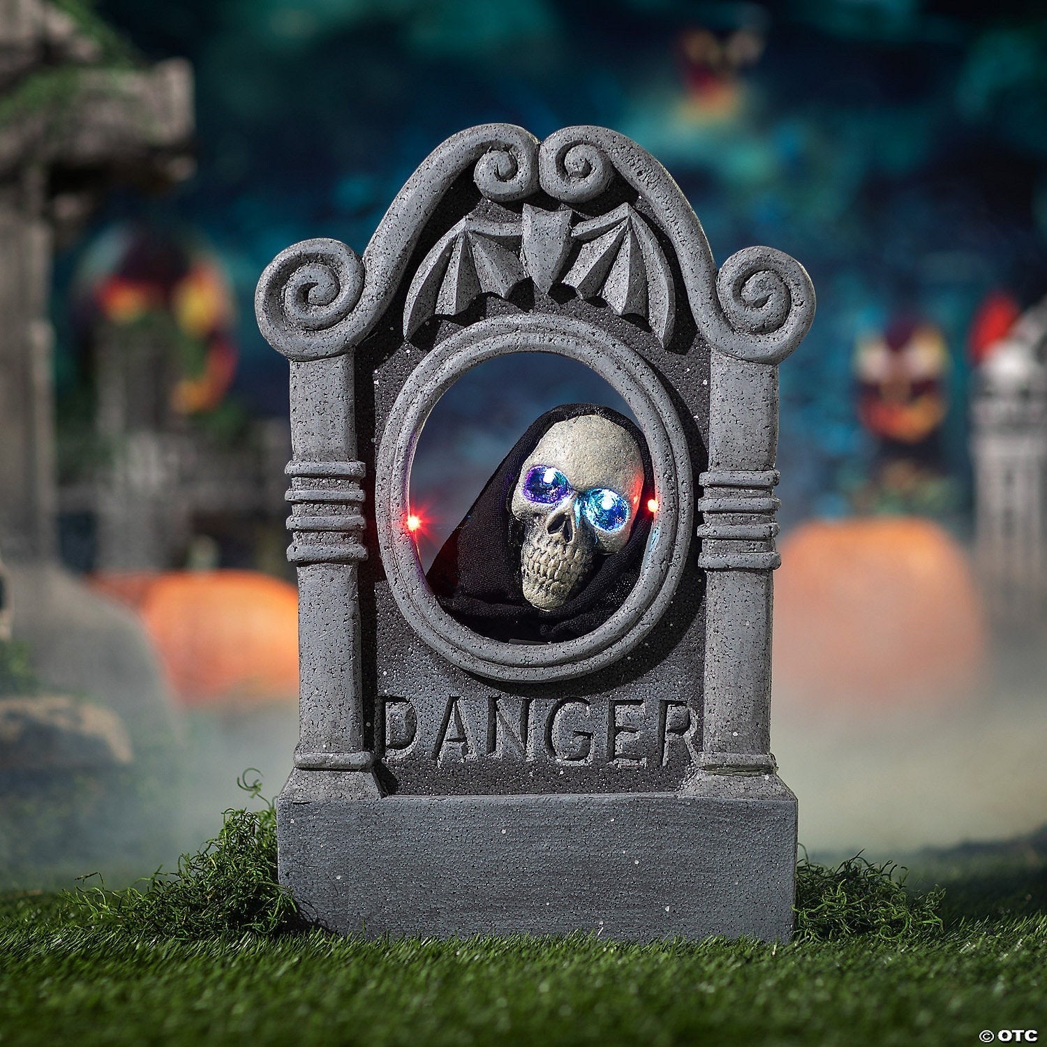 Halloween-Emporium animated tombstone with a hooded skull, glowing blue LED eyes, and weathered stone finish.