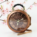 Halloween-Emporium antique clock bag in bronze vinyl with a protective cover, top handle, and shoulder strap.