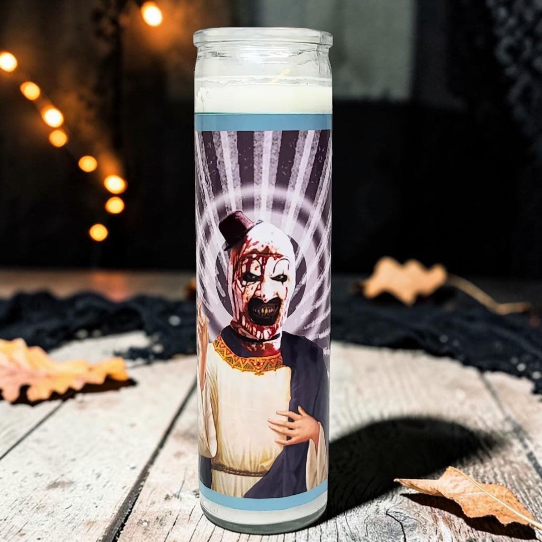 Halloween-Emporium Art the Clown horror icon devotional prayer candle in a white wax glass container.