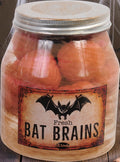 Halloween-Emporium decorative specimen jar containing pink bat brains with a vintage-style weathered label