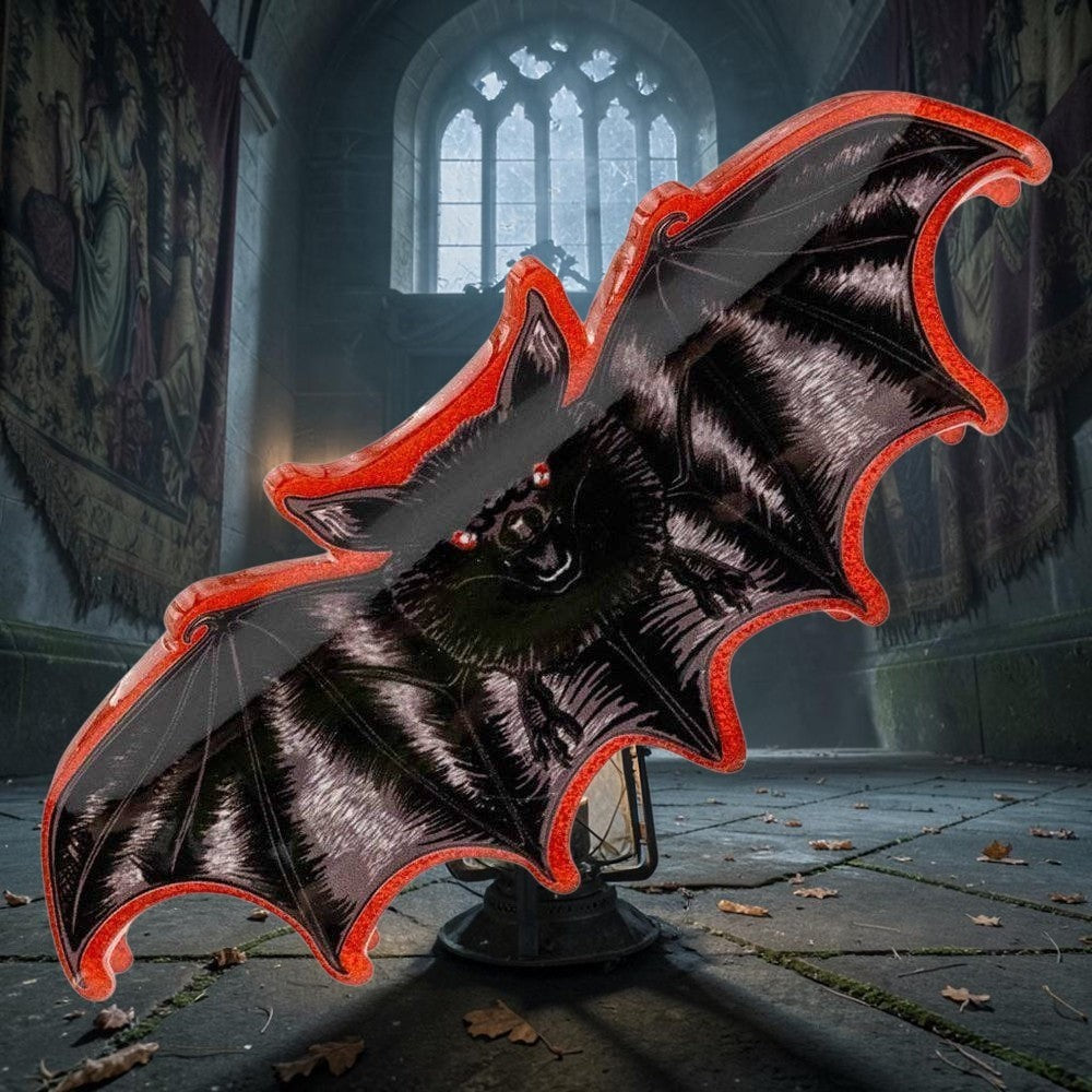 Halloween-Emporium bat-shaped acrylic claw clip with a detailed black bat illustration and vibrant red glitter border.