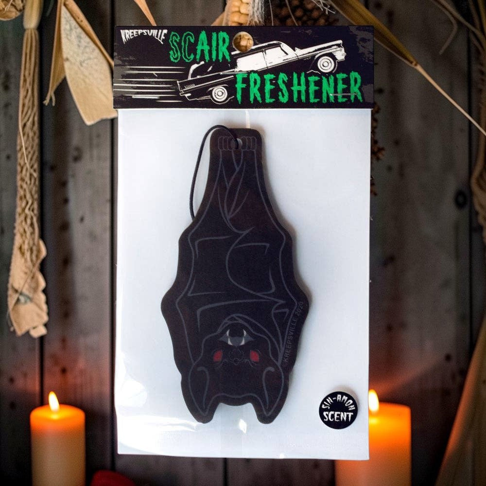 Halloween-Emporium bat hanging air freshener in black with red accents and spicy sin-amon scent in retail packaging