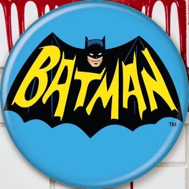Halloween-Emporium 1.25-inch round Batman logo button featuring a yellow Batman emblem on a bright blue background