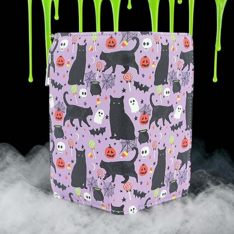 Halloween-Emporium vinyl wallet featuring a purple background with black cat, pumpkin, and ghost Halloween patterns.