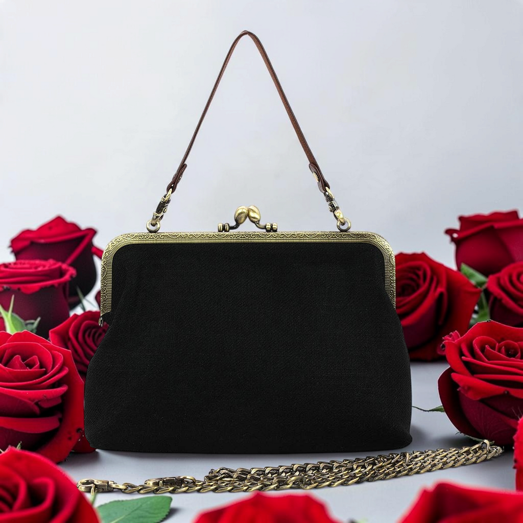 Halloween-Emporium black linen cotton kiss lock bag with antique metal frame, surrounded by red roses.