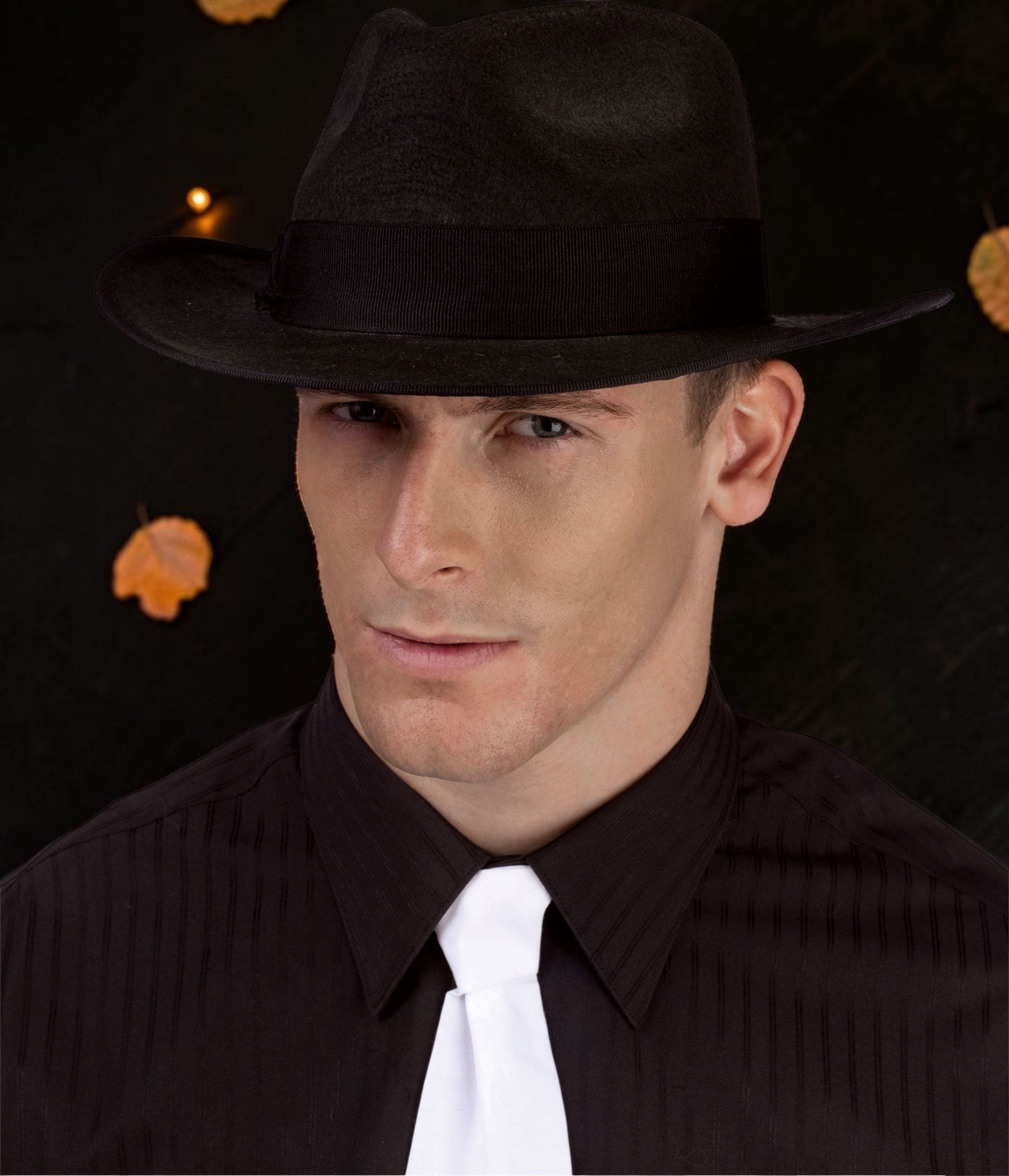 Halloween-Emporium classic black felt fedora hat with a ribbon band worn by a man in a black shirt and white tie.
