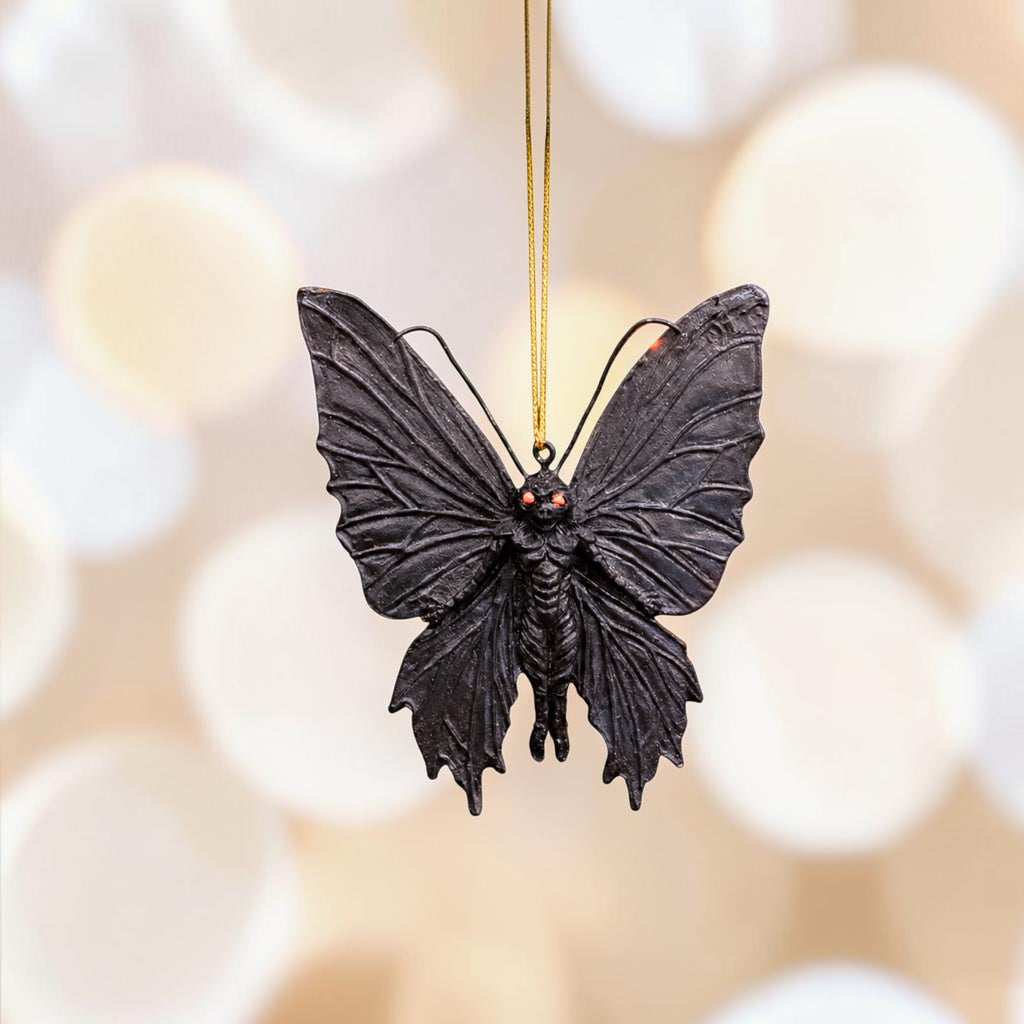 Halloween-Emporium gothic mothman hanging ornament with black textured wings and glowing red eyes.