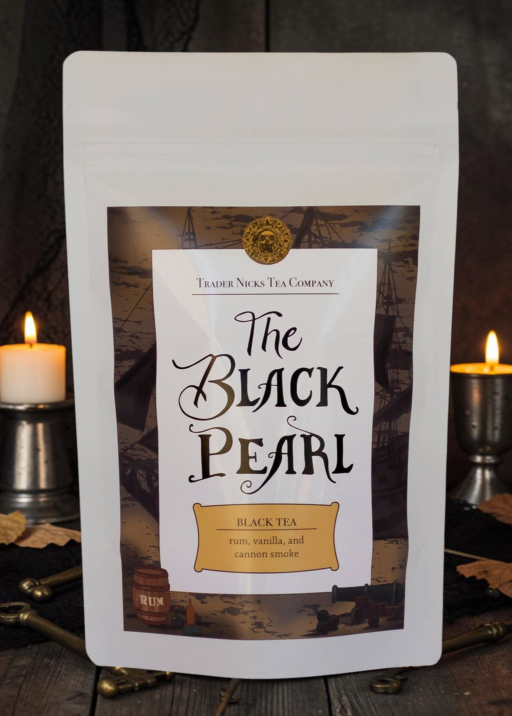 Halloween-Emporium The Black Pearl rum and smoke flavored black tea in a white stand-up pouch with pirate branding.