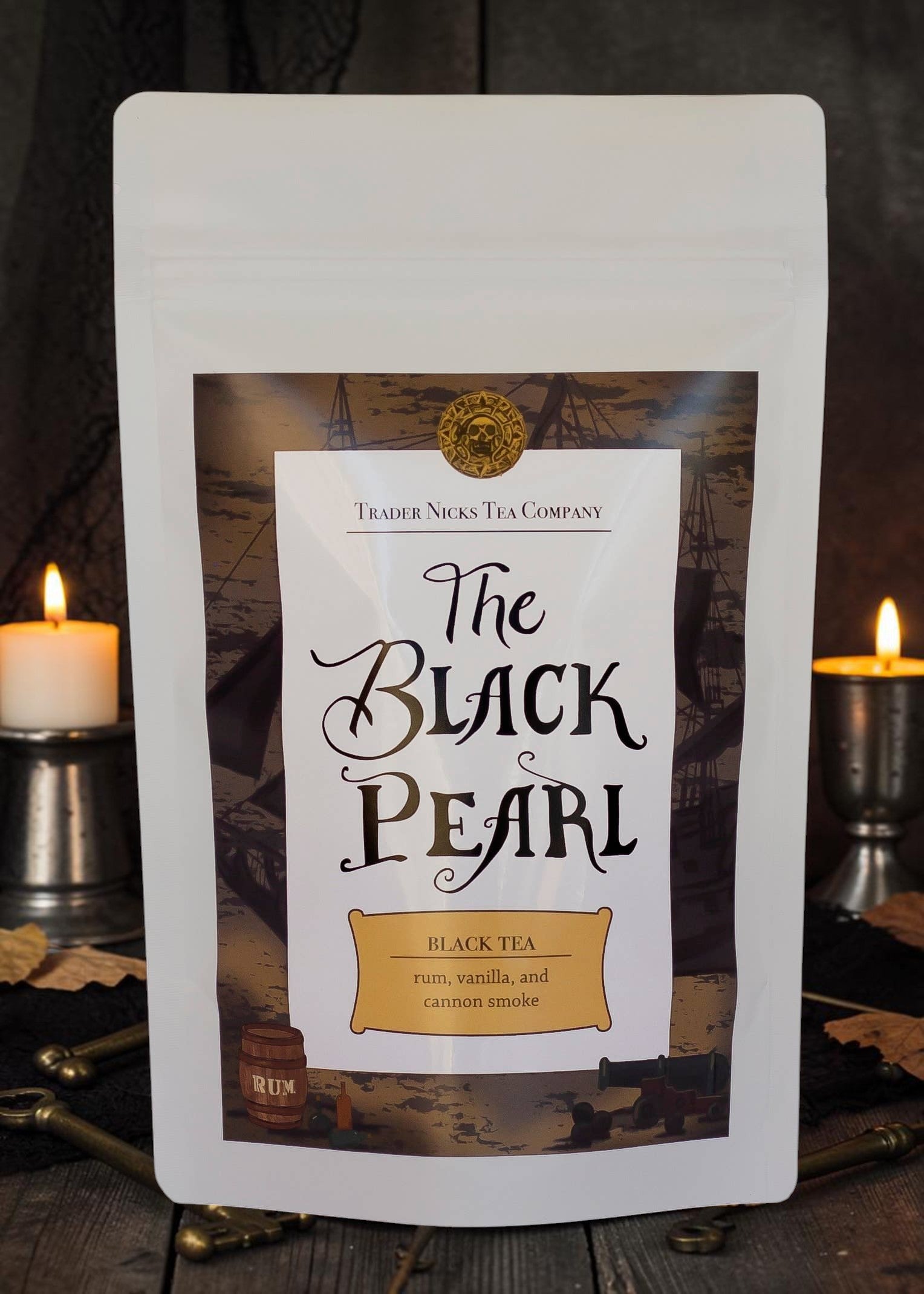 Halloween-Emporium The Black Pearl rum and smoke flavored black tea in a white stand-up pouch with pirate branding.