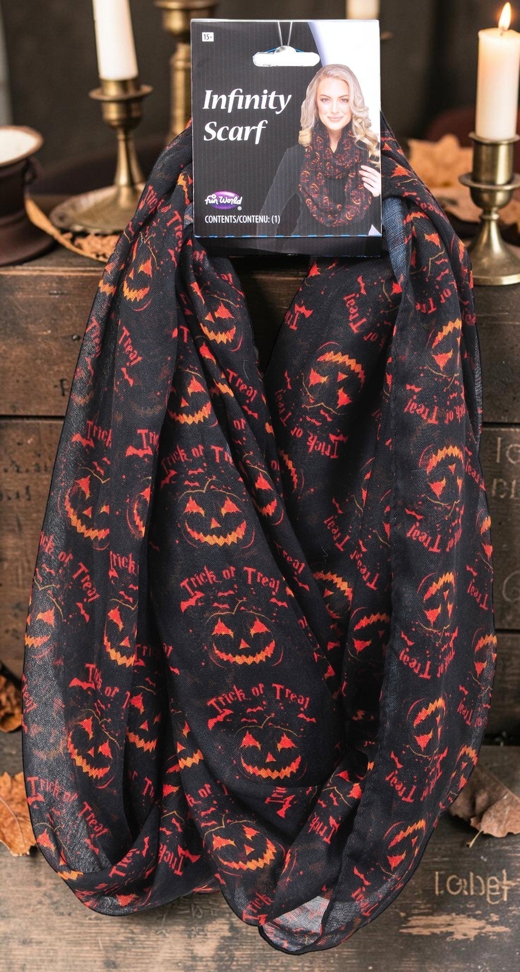 Halloween-Emporium black infinity scarf featuring orange jack-o'-lanterns and Trick or Treat text for autumn style.