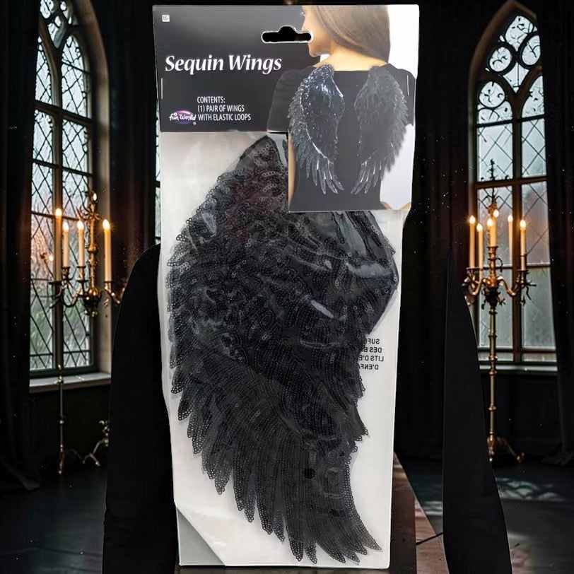 Halloween-Emporium black sequin angel wings costume accessory in retail packaging for gothic or fallen angel looks.