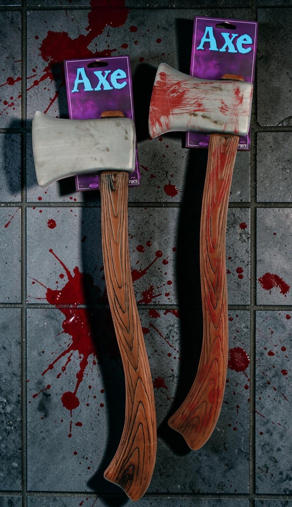 Halloween-Emporium plastic axe prop with weathered metallic blade, blood splatter, and wood-grain handle.