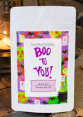 Halloween-Emporium Boo to You black tea pouch with festive green, purple, and orange label featuring ghosts and bats.
