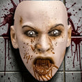Halloween-Emporium Brody Monster plastic face mask with pale skin, gruesome splattered details, and jagged teeth.