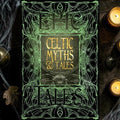 Halloween-Emporium Celtic Myths & Tales hardback book with ornate green and gold gothic cover design on wooden table