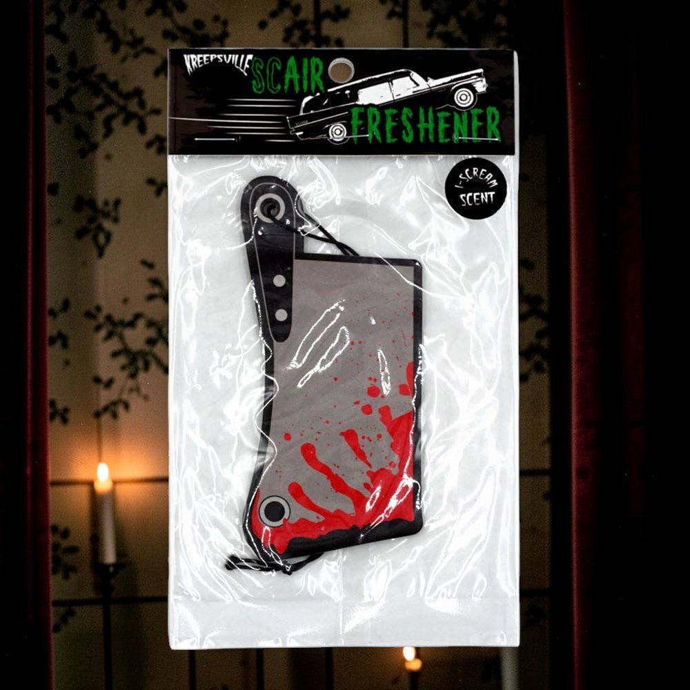 Halloween-Emporium cleaver-shaped car air freshener with red blood splatter design in original plastic packaging.