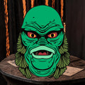 Halloween-Emporium 4-inch Creature sticker featuring a detailed green swamp monster with intense eyes and textured scales.