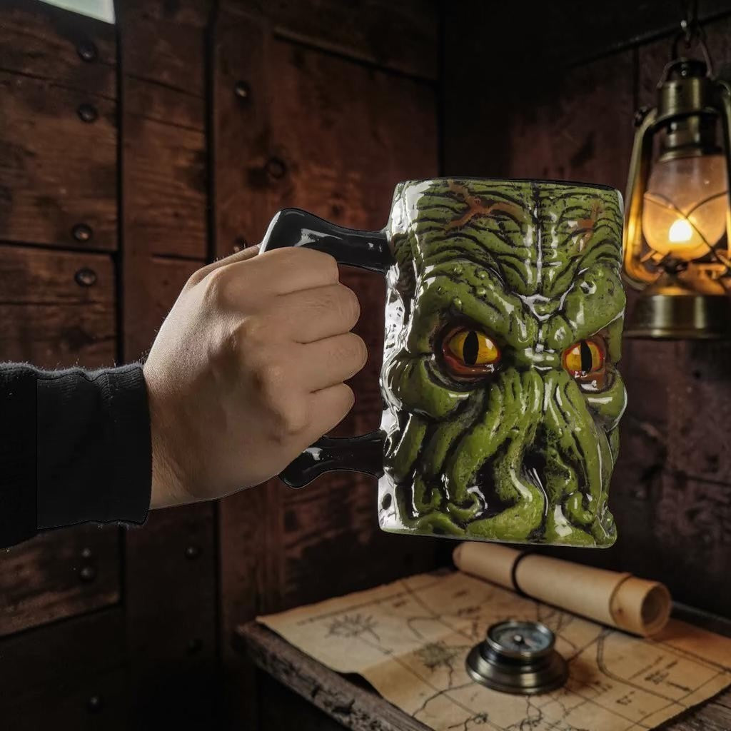 Halloween-Emporium Cthulhu ceramic mug with green tentacle design and yellow eyes held in a dark rustic setting