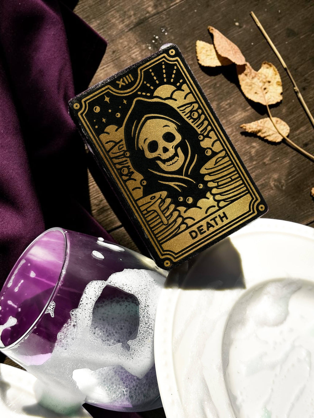 Halloween-Emporium Death tarot card kitchen sponge with metallic gold skull illustration on a dark background