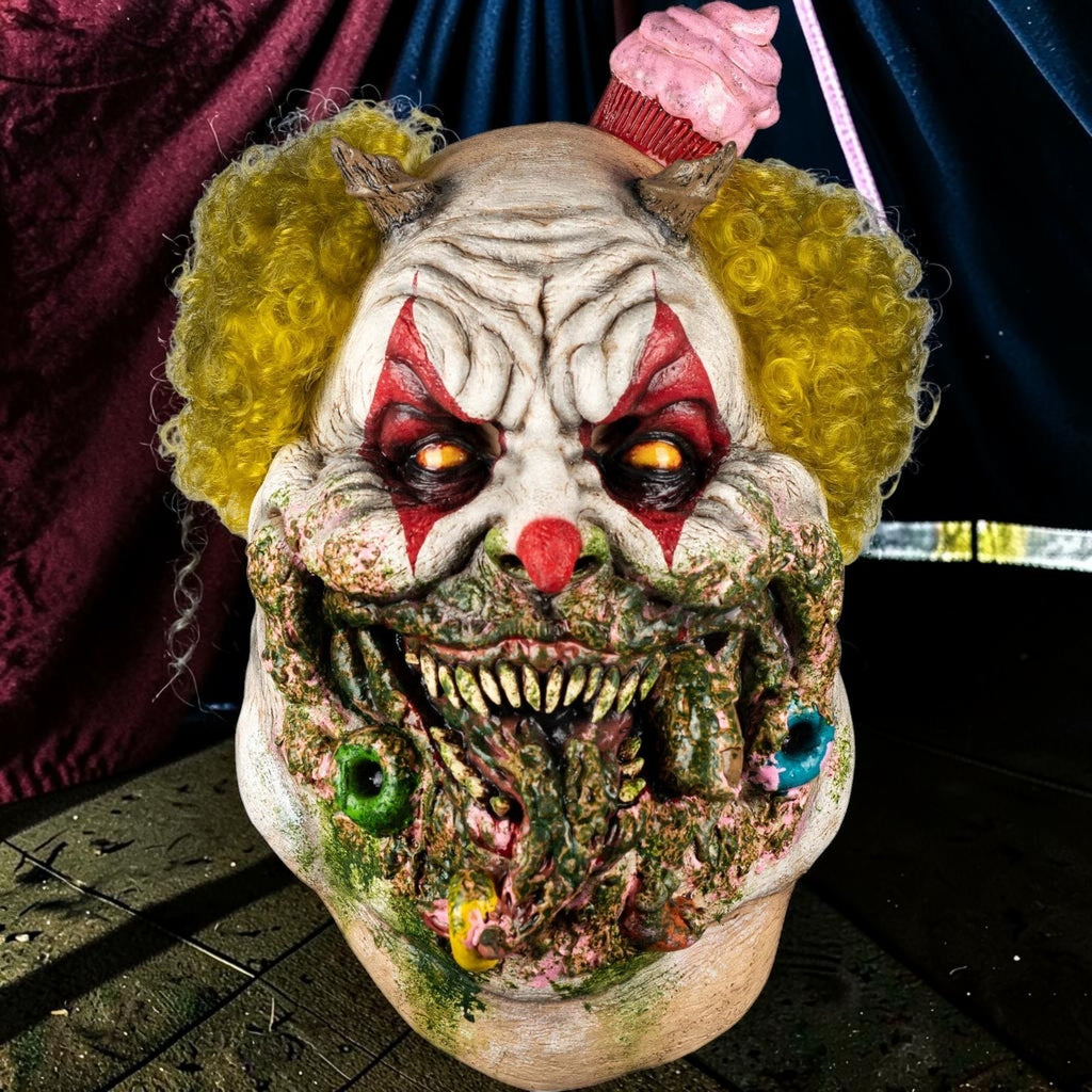 Halloween-Emporium Charles Demon of Gluttony latex clown mask with yellow hair, horns, and grotesque food details.