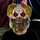 Halloween-Emporium Charles Demon of Gluttony latex clown mask with yellow hair and grotesque horror details.