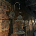 Halloween-Emporium wall mounted metal railroad lantern with a distressed black weathered patina finish.