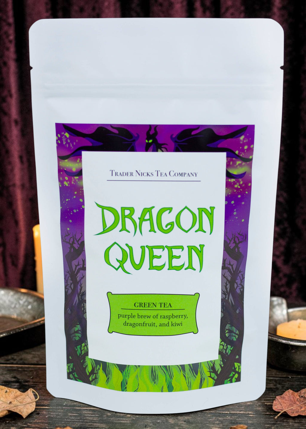Halloween-Emporium Dragon Queen green tea blend in a white pouch with Maleficent-themed purple and green label art.
