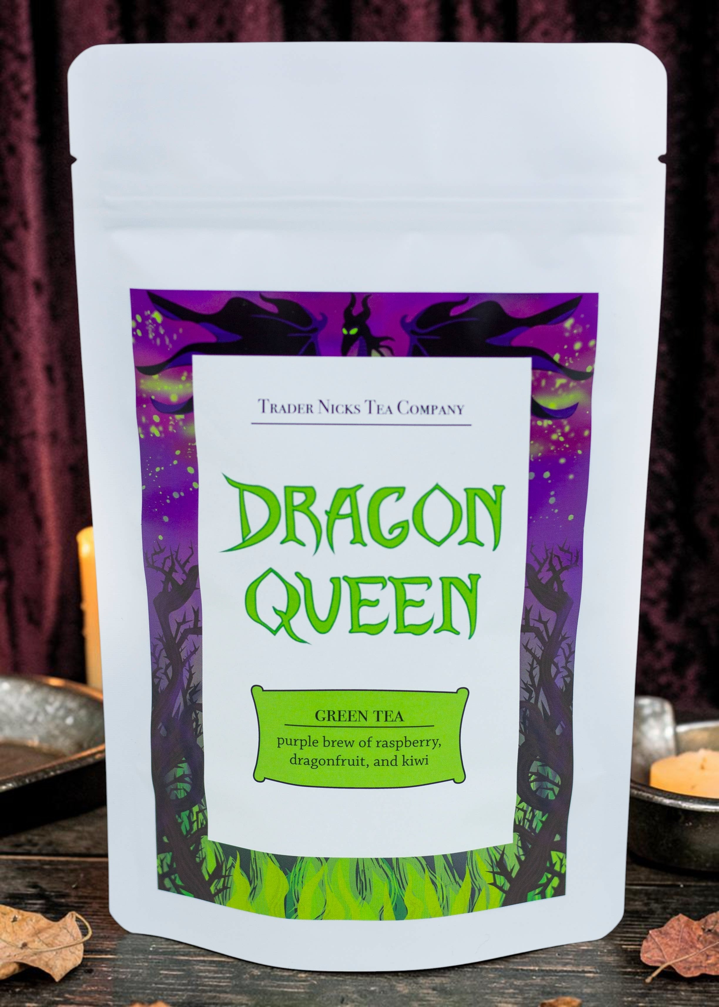 Halloween-Emporium Dragon Queen green tea blend in a white pouch with Maleficent-themed purple and green label art.