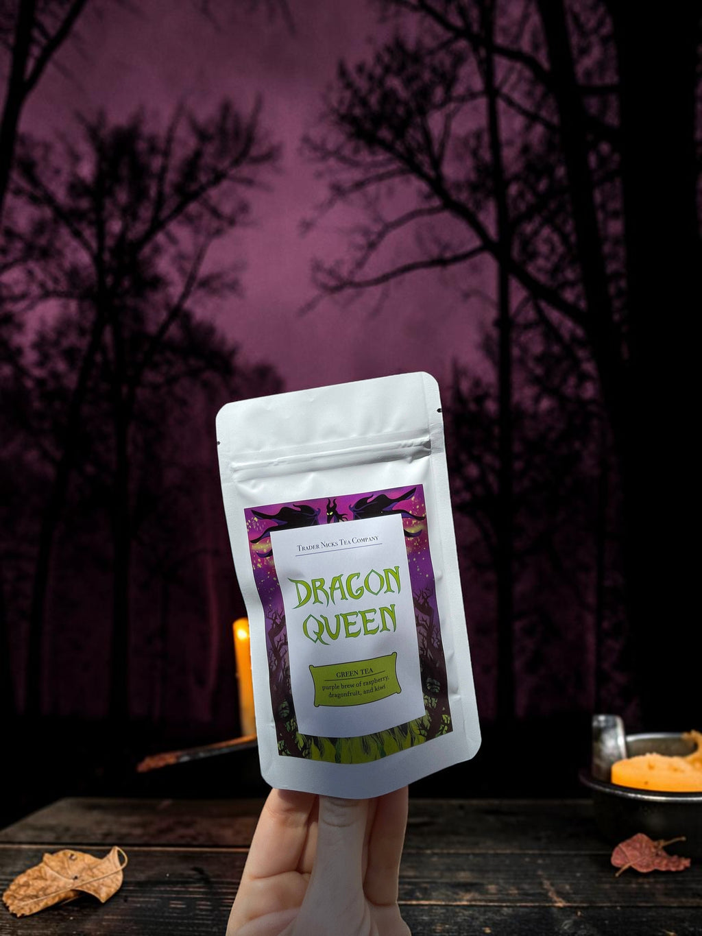 Halloween-Emporium Dragon Queen green tea pouch featuring Maleficent-themed label against a dark forest background.
