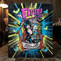 Halloween-Emporium Elvira Ghostcoaster plush throw blanket featuring vibrant comic-style art of Elvira on a roller coaster.