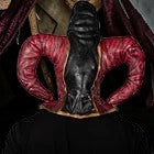Halloween-Emporium handmade latex evil jester mask with extended neck and red and black textured details