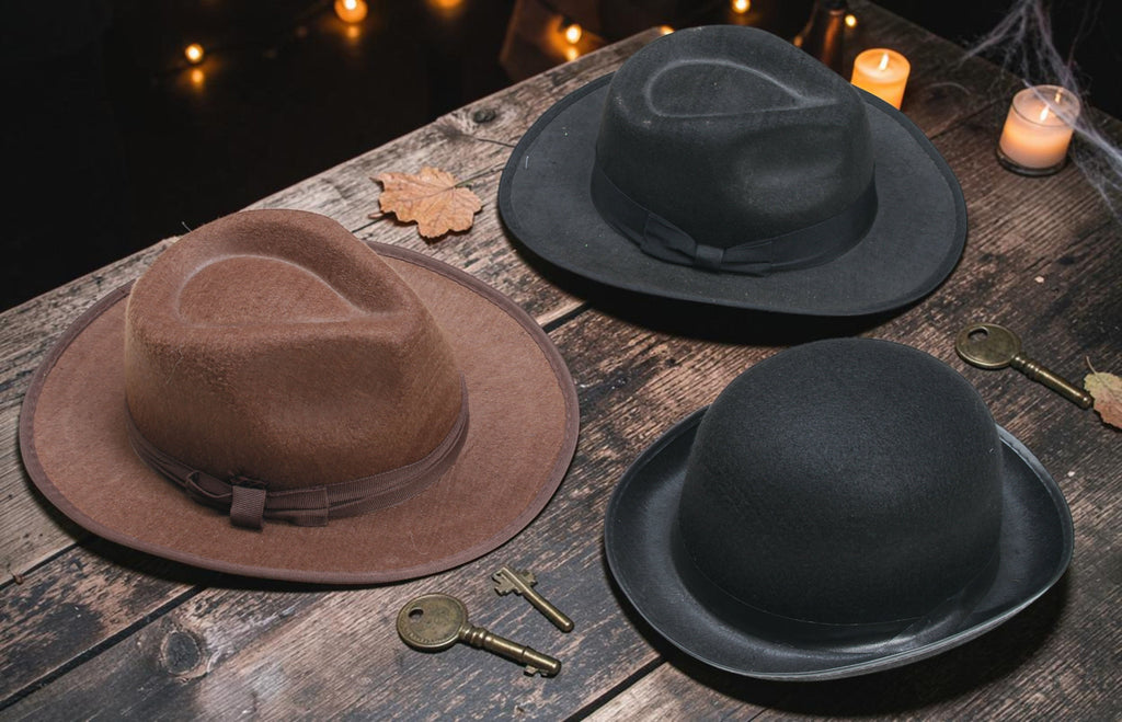 Halloween-Emporium classic felt fedora and bowler hats in brown and black on a rustic wooden table with vintage keys.