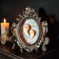 Halloween-Emporium vintage style framed ghost figurine with two hand-sculpted ghosts in an ornate silver Victorian frame.
