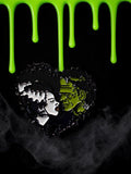 Halloween-Emporium Frankenstein and Bride heart-shaped soft enamel pin with green and black details.