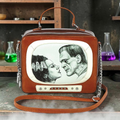 Halloween-Emporium Frankenstein and Bride glow in the dark retro TV shaped crossbody bag with chain strap
