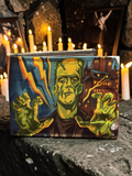 Halloween-Emporium hand crafted wallet featuring a vibrant Frankenstein monster illustration with lightning