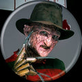 Halloween-Emporium 1.25 inch round lapel pin featuring Freddy Krueger from Nightmare on Elm Street on a grey background