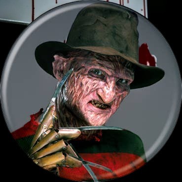 Halloween-Emporium 1.25 inch round lapel pin featuring Freddy Krueger from Nightmare on Elm Street on a grey background