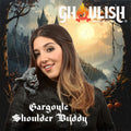 Halloween-Emporium Ghoulish Productions gargoyle shoulder buddy with red eyes worn by a woman in a leather jacket