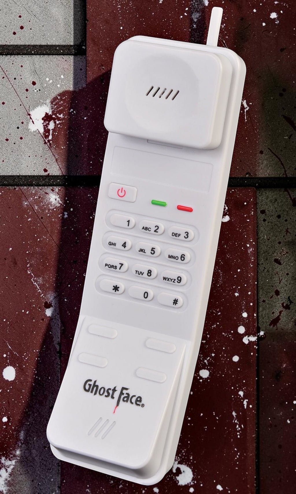 Halloween-Emporium white Ghost Face phone prop with keypad and ringing sound effect for horror costumes
