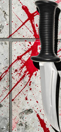 Halloween-Emporium Ghost Face prop knife with a silver blade and black textured handle against a bloody tile background